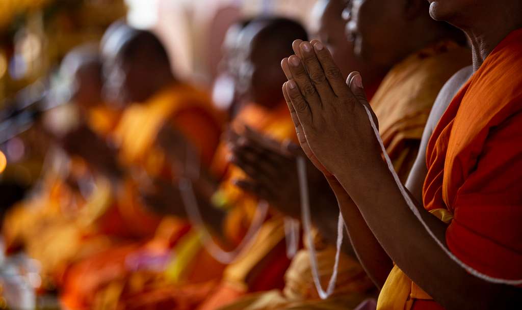 Buddhist monks praying