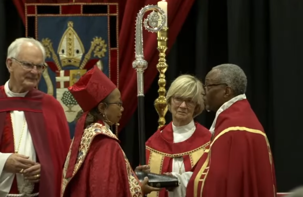 New Bishop of the Episcopal Church of Mississippi Dorothy Wells stands with The Most Reverend Michael Curry.