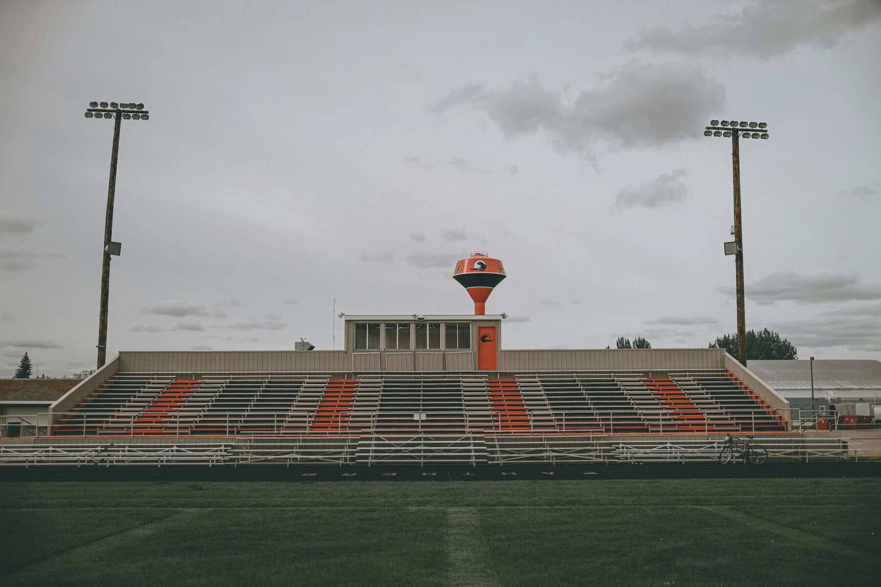 An empty high school football stadium.