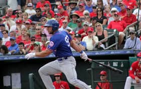 Tim Tebow running after batting.