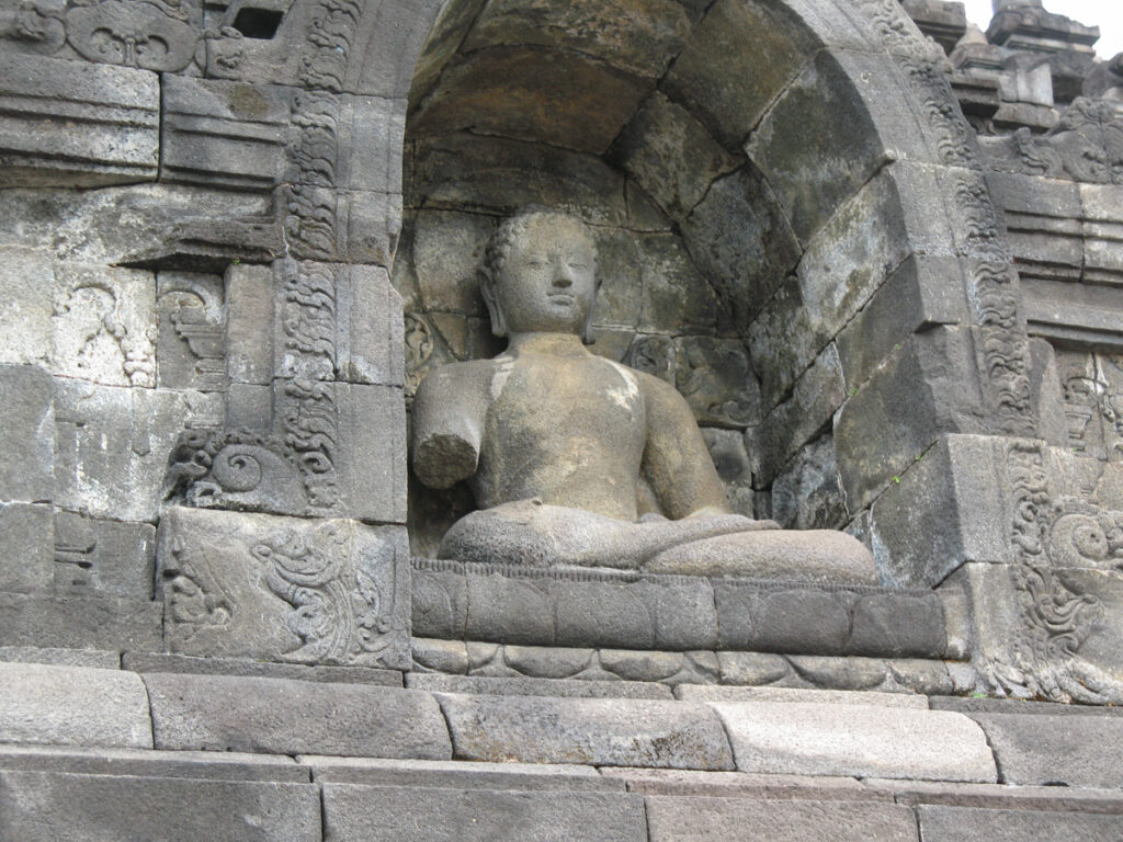 Statue at Borobudur- the largest Buddhist temple in the world in Java.