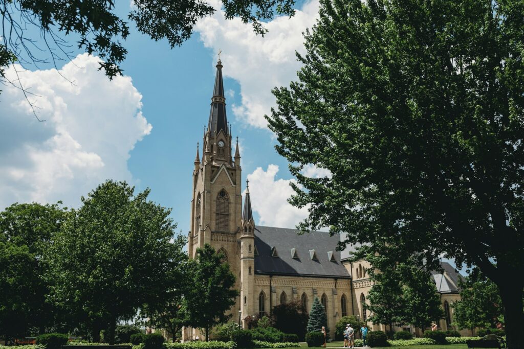 Wide Shot of the Basilica of the Sacred Heart at the University of Notre Dame through the trees