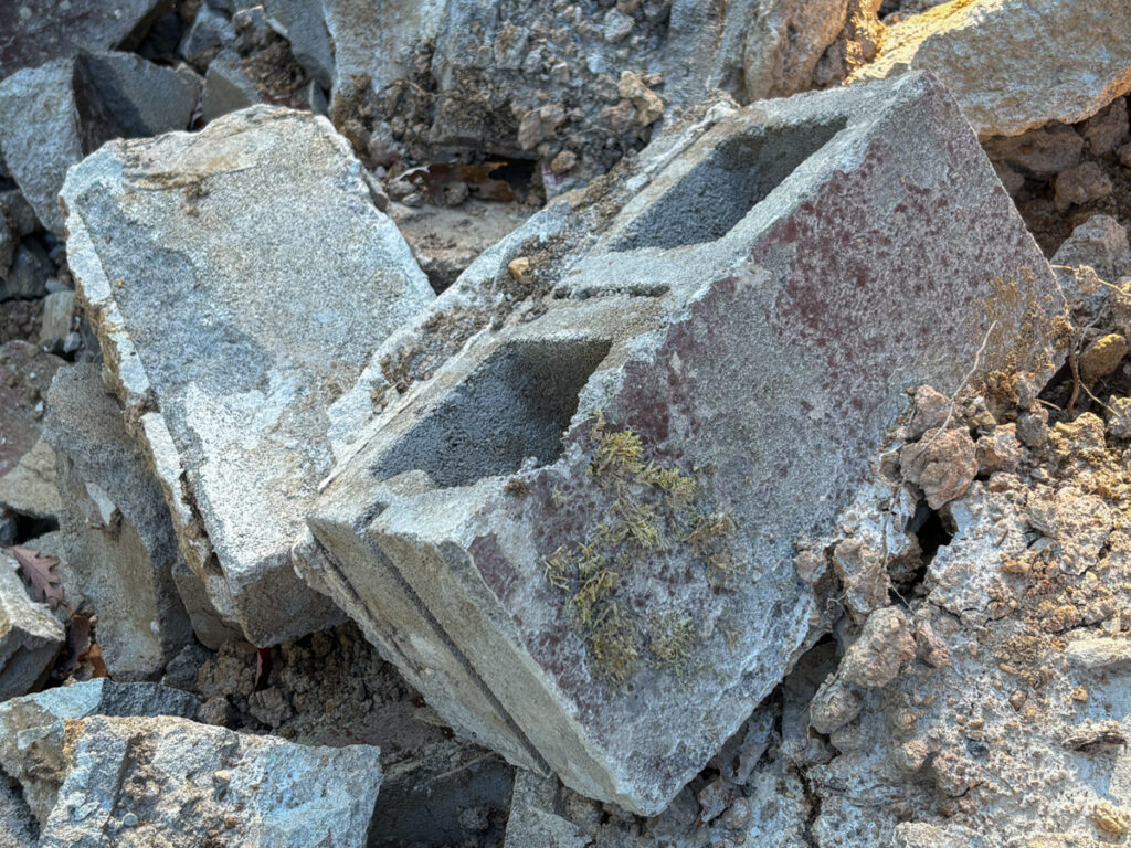 Old cinder block wall rubble.