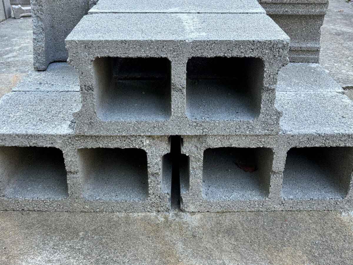 Stacked grey cinder blocks.