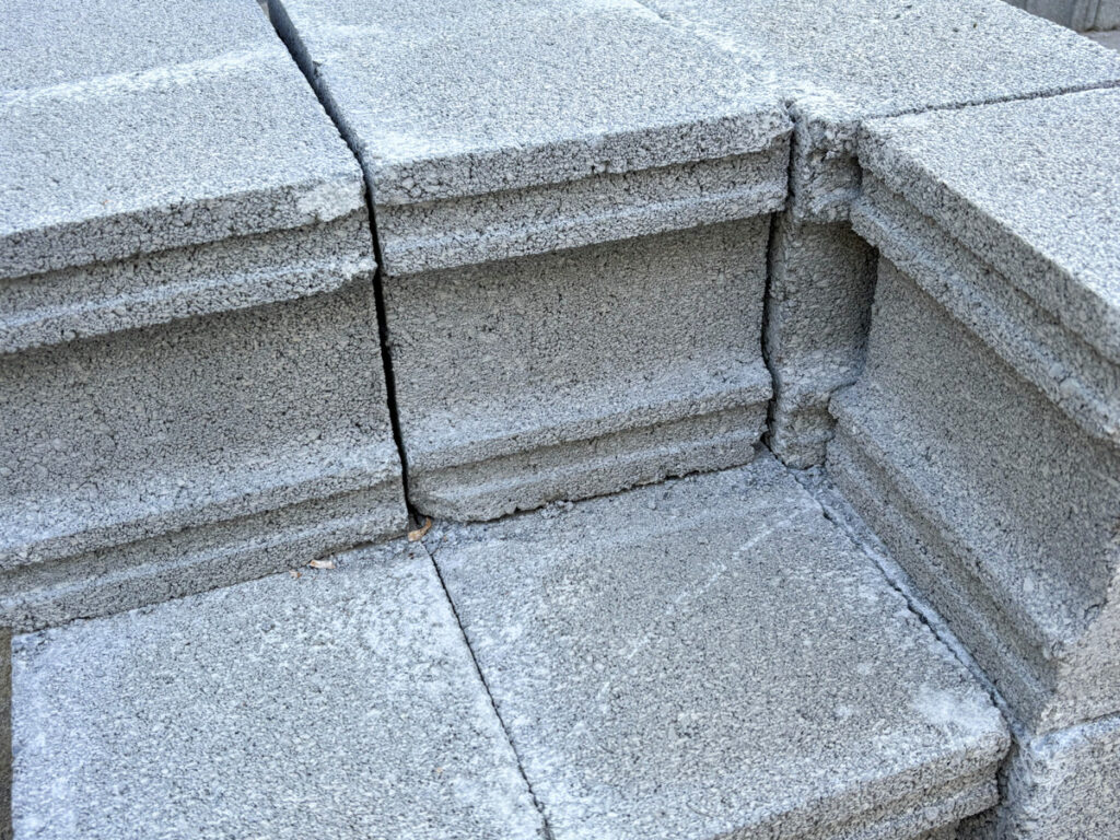 Cinder blocks stacked and forming a corner.