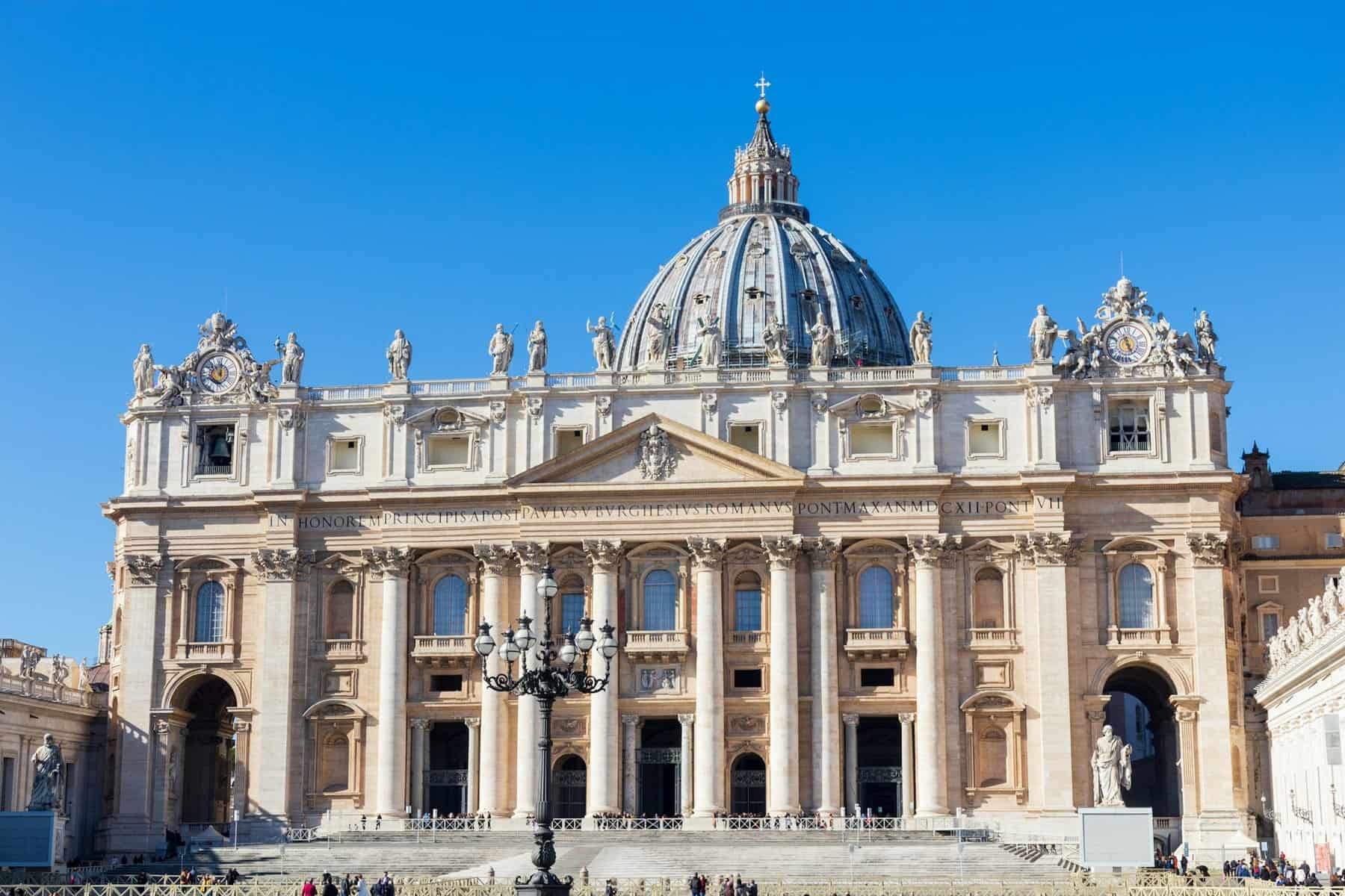 Street view of a domed building in the Vatican.