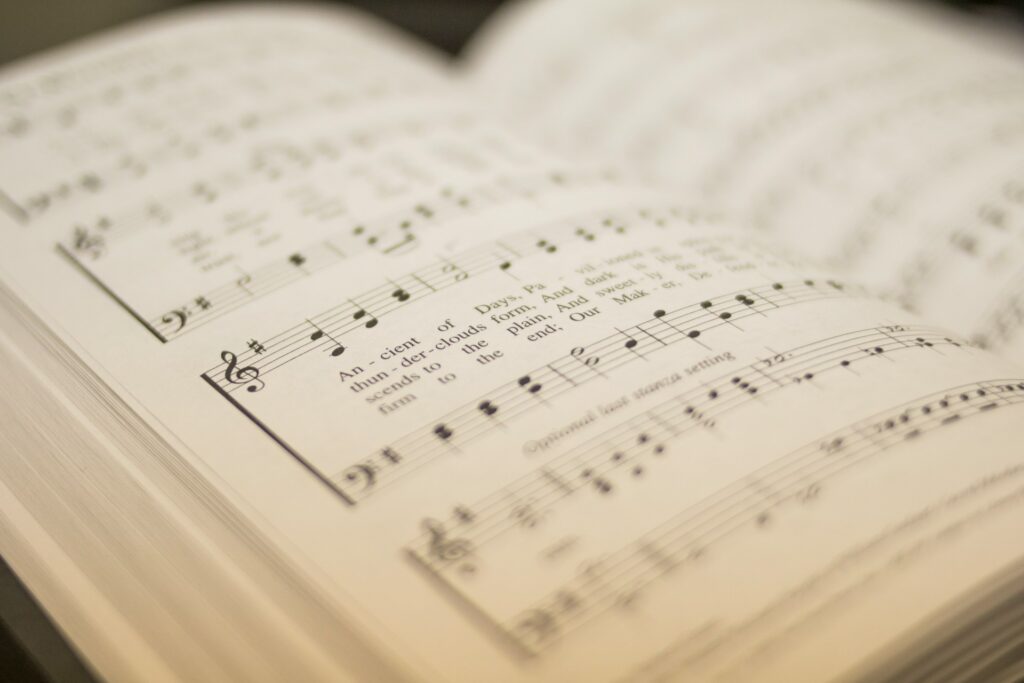 An open hymnal with a shallow depth of field.