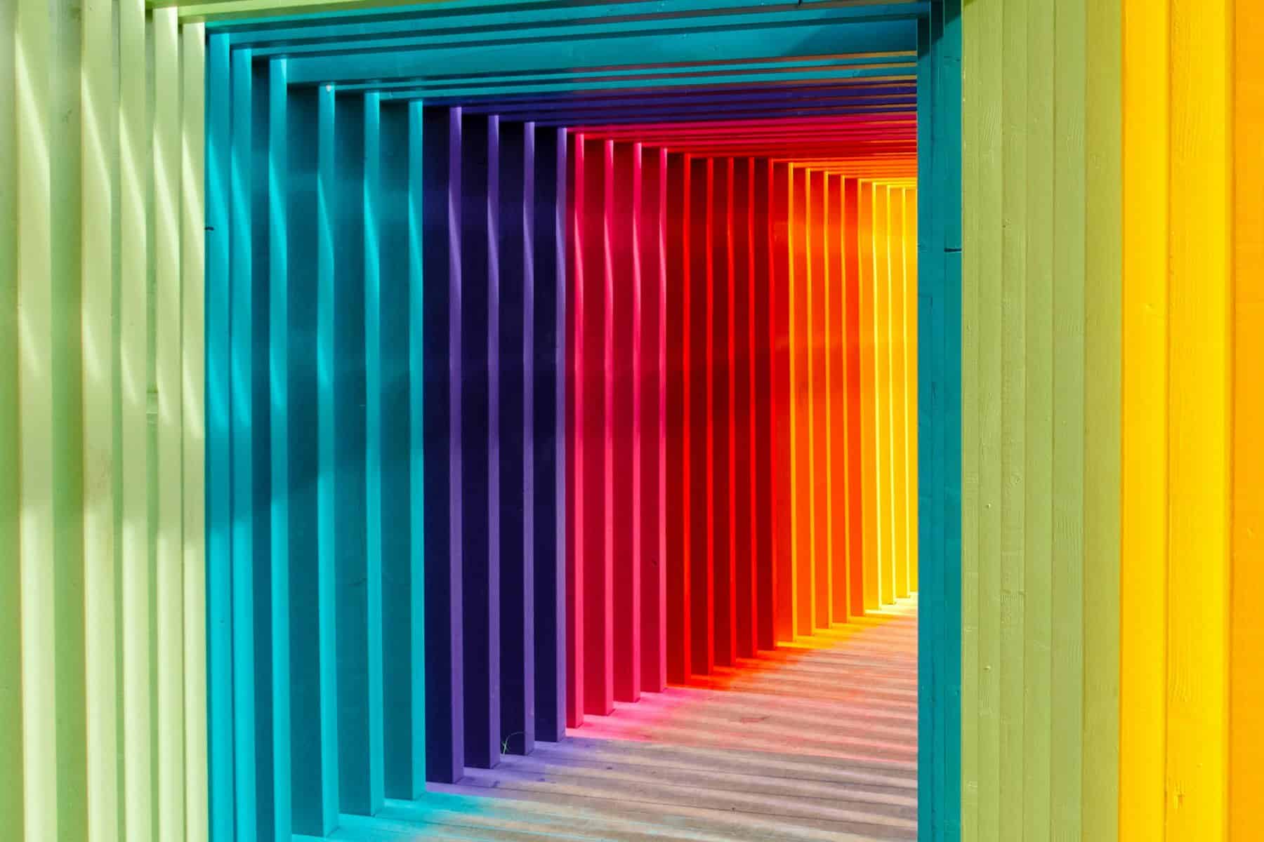 A tunnel-like walkway made of multicolored frames.