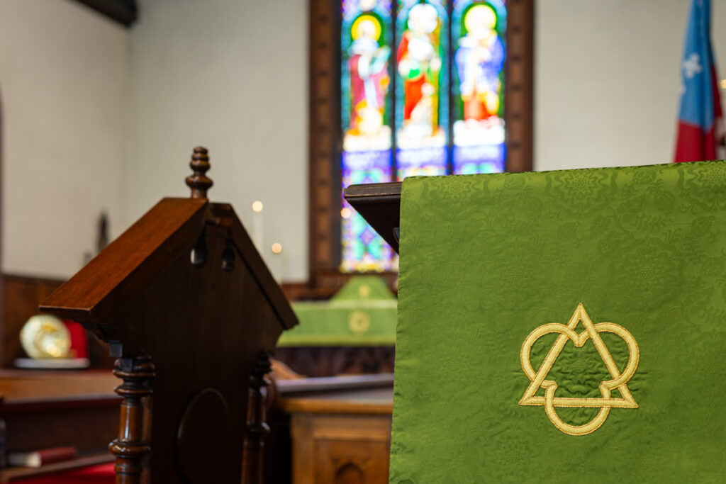 A close up of the pulpit inside an Episcopal church.