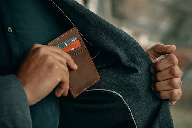 wallet being put into a pocket