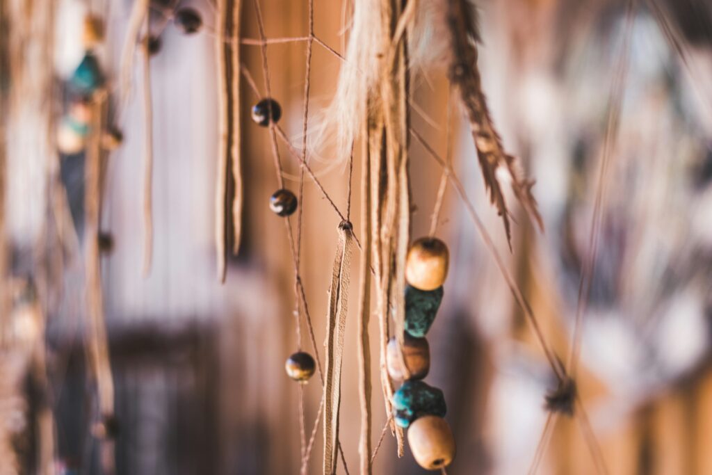 Feathers and beads close up.