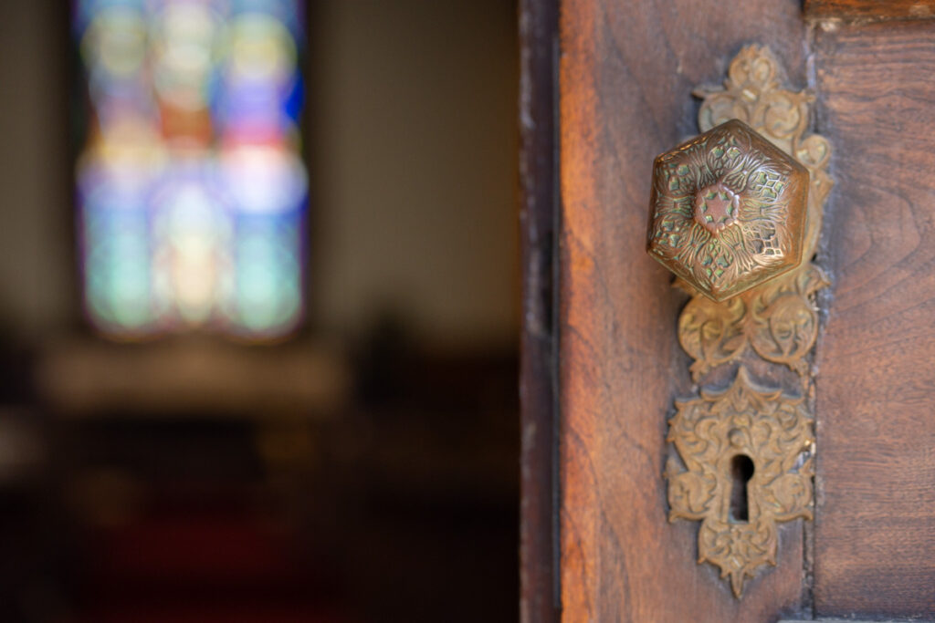 Door knob and filigree of a late 1800s church.