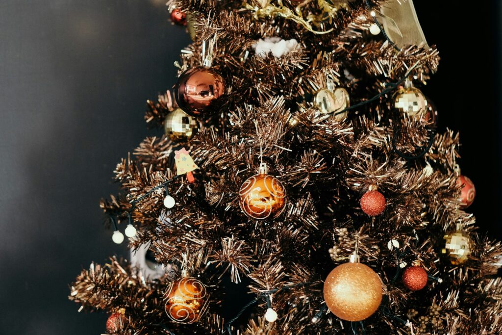 A Christmas tree with gold and red.