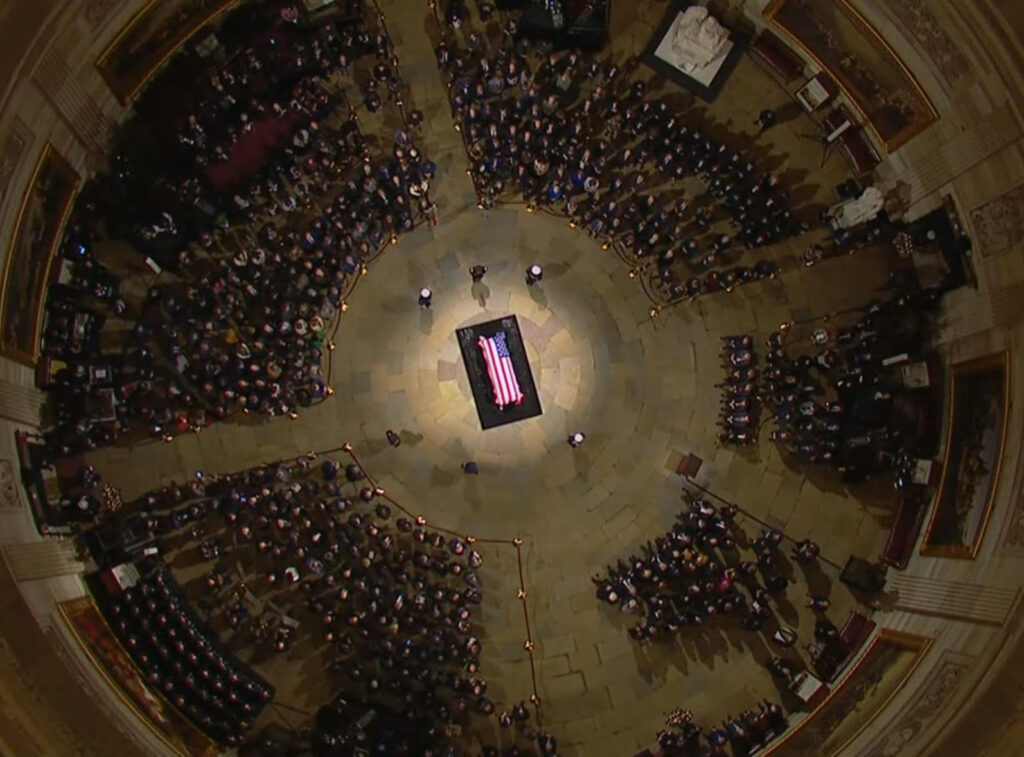 President Carter's casket lies in state in the Rotunda surrounded by family, congress, and dignitaries.