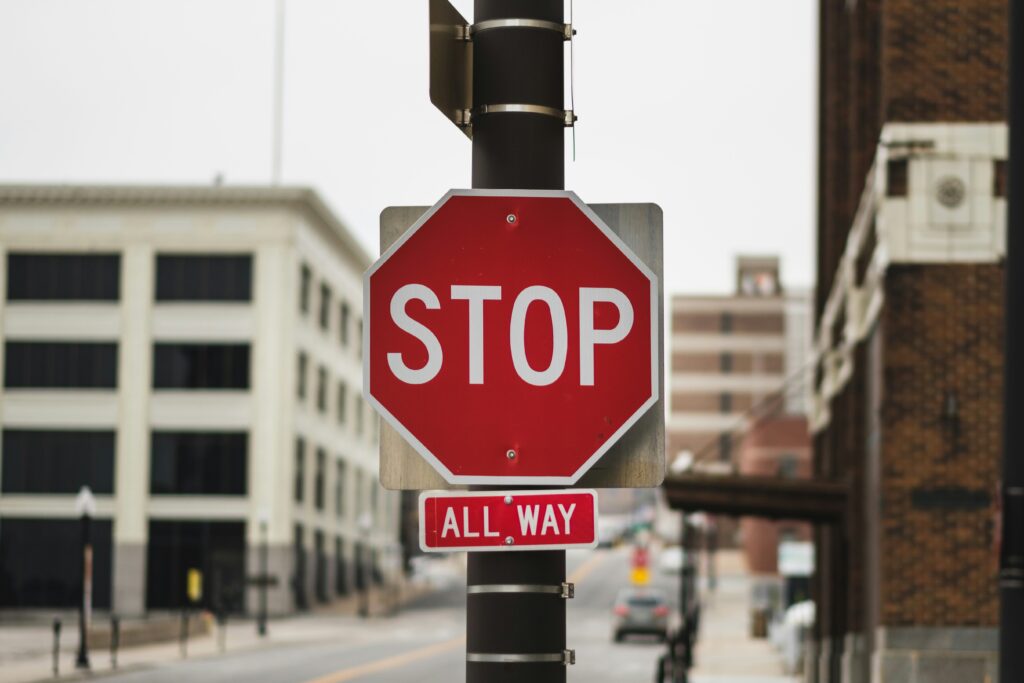 A stop sign at a four way stop