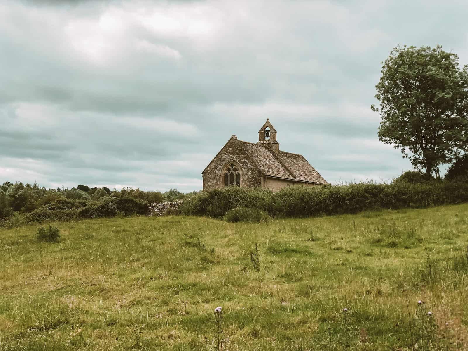 Old stone church in a field in England.