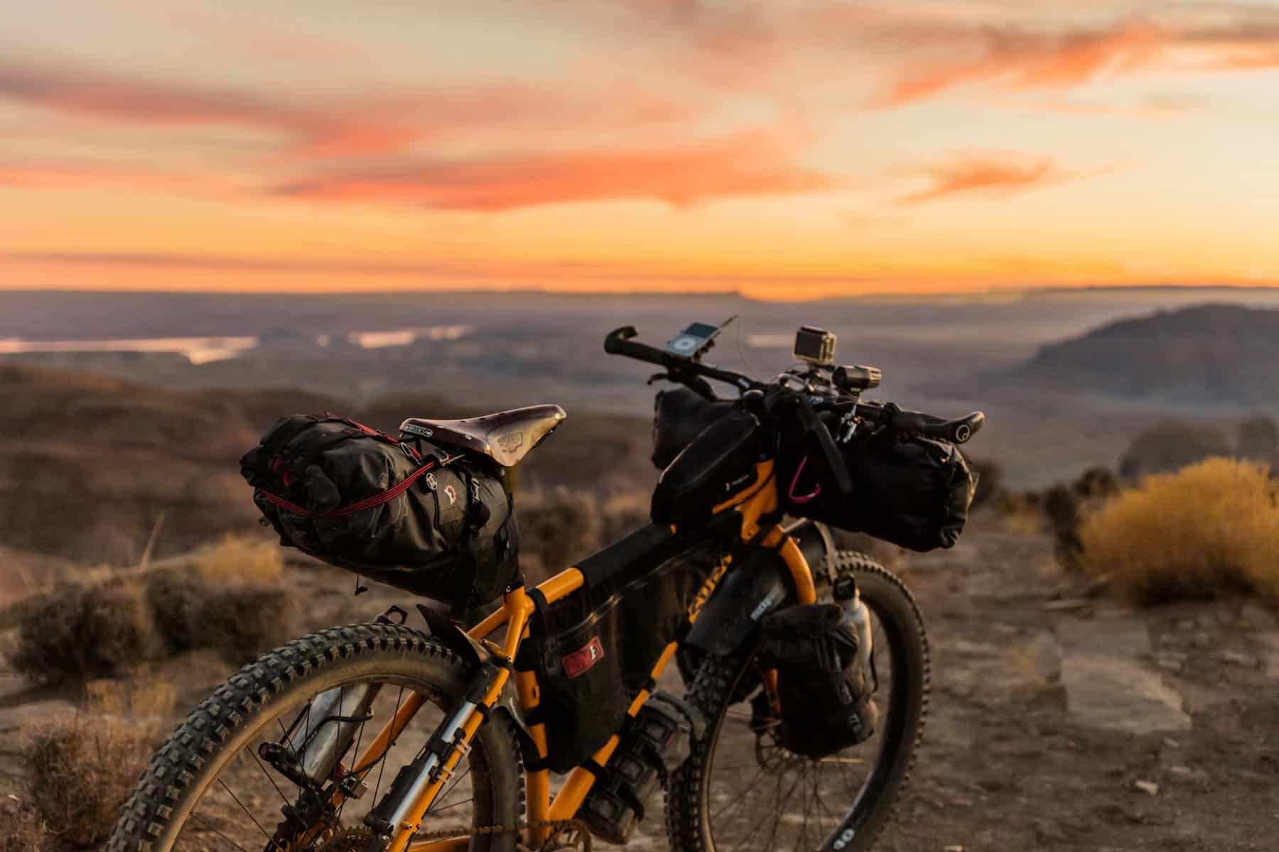 A trail bike seen from behind at sunset.