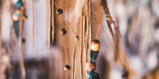 Feathers and beads close up.