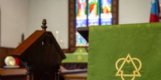 A close up of the pulpit inside an Episcopal church.