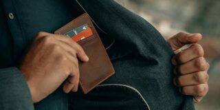 wallet being put into a pocket