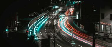 Slow shutter speed image showing automobile light trails at night on an road in Switzerland.