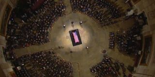 President Carter's casket lies in state in the Rotunda surrounded by family, congress, and dignitaries.