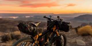 A trail bike seen from behind at sunset.