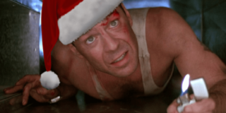 Bruce Willis is shown crawling in an air duct wearing a Santa hat in the movie Die Hard.