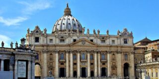 a street view photo of St. Peter's Basilica is shown against a blue sky