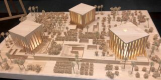 A physical table top model shows to the Abrahamic Family House complex.