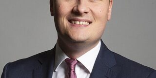 Wes Streeting is shown in an official portrait.