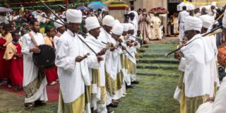 Orthodox priests dancing in front of Saint Mary church for 2015 Timkat in Addis Ababa, Ethiopia