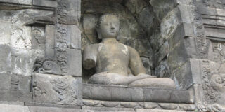 Statue at Borobudur- the largest Buddhist temple in the world in Java.