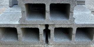 Stacked grey cinder blocks.