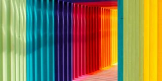 A tunnel-like walkway made of multicolored frames.